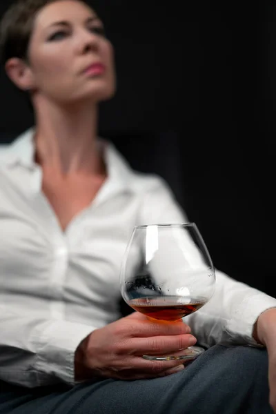 Drinking Glass Filled Alcohol Held Sad Looking Woman Business Clothes — Stock Photo, Image