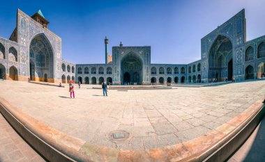 Isfahan, Iran - 04.20.2019: Courtyard of the blue Shah Mosque of Isfahan located on the south side of Naghsh-e Jahan Square. Safavid dynasty heritage. Beautiful sunny day in Islamic temple