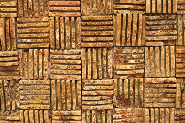 красивый коричневый объемный фон из натурального объемного камня. Высокое качество фото