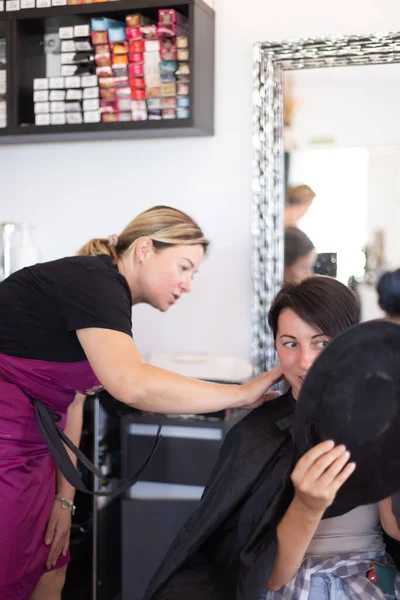 Woman Examines Her Haircut Mirror Hairdresser Selective Focus — Stock Photo, Image