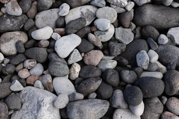 Texture of the seashore with stones. Natural background