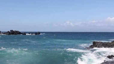 Surf waves rolling over a reef with white water break. Splash of the wave. 4k footage