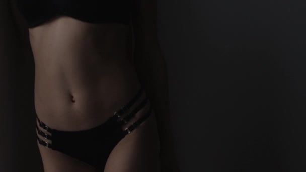 Woman in black lingerie showing body shapes — Stock Video