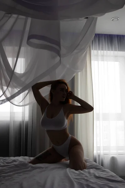 Side View Seductive Female White Lingerie Sitting Soft Bed Touching — стоковое фото