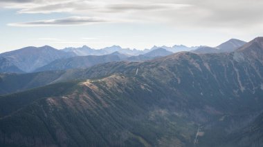 Alpine landscape with mountain ridgelines, peaks and forest in autumn colors, Slovakia, Europe.