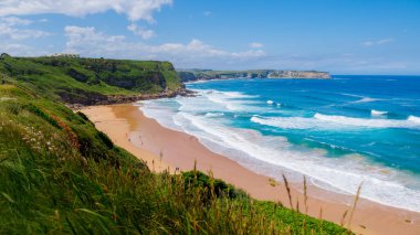 Beatiful ocean coast in summer day. Spain, suburb of Suances, summer day in the Province of Cantabria, it is photographed from Playa de Los Locos clipart