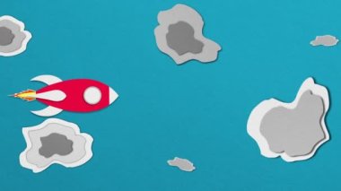 Kırmızı kağıt uzay gemisi uzayda uçuyor. Meteorun ortasındaki dur hareketine meydan oku..