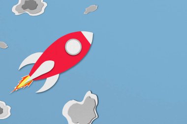 red paper spaceship flying in space with meteors Paper design.