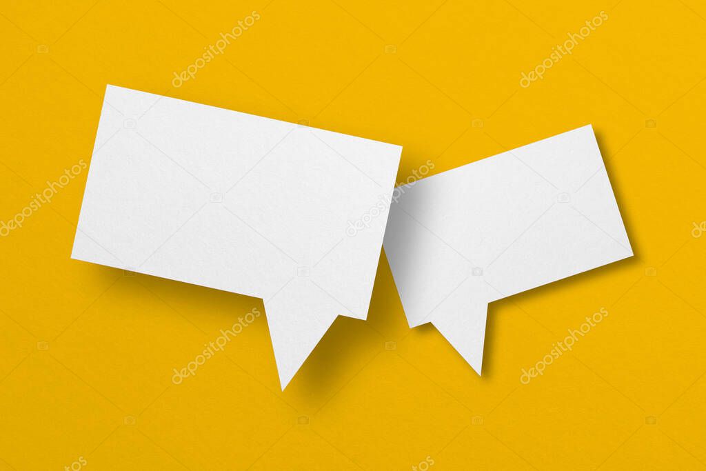 speech balloon shape white paper isolated on yellow background Communication bubbles.