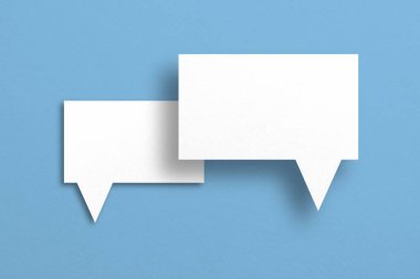 white paper with speech bubbles isolated on blue background communication bubbles design.