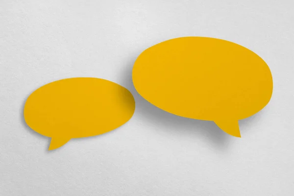 Speech Balloon Shaped Yellow Paper Isolated White Background Communication Bubbles — Stockfoto