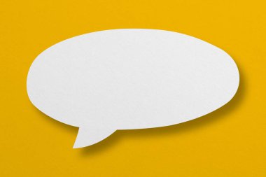 speech balloon shape white paper isolated on yellow background Communication bubbles.