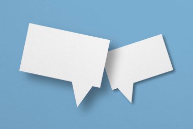 white paper with speech bubbles isolated on blue background communication bubbles design.