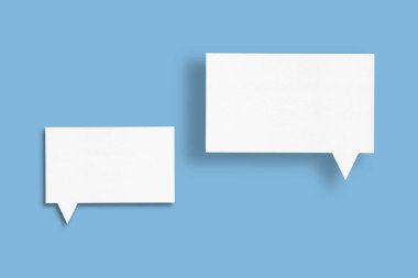 white paper with speech bubbles isolated on blue background communication bubbles design.