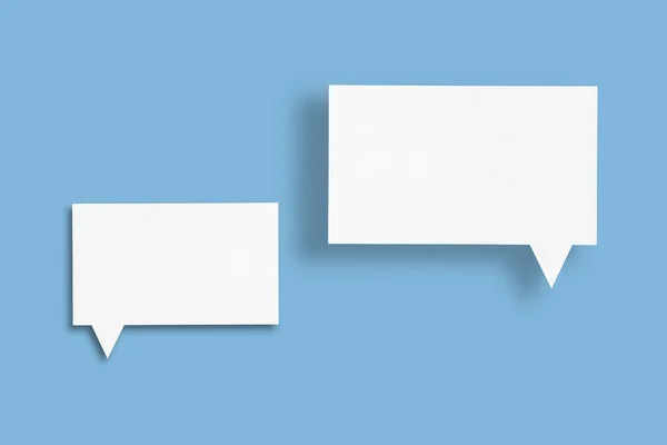White Paper Speech Bubbles Isolated Blue Background Communication Bubbles Design — Stockfoto
