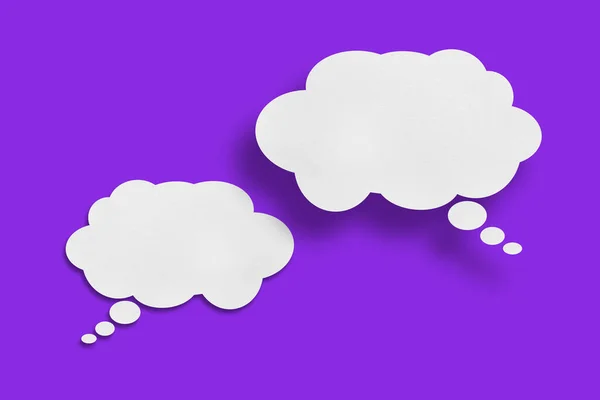 white cloud paper speech bubble shape against purple background design.