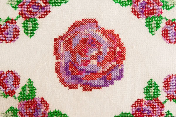 Decorative element, cross-stitch embroidery of rose flowers. — Stock Photo, Image