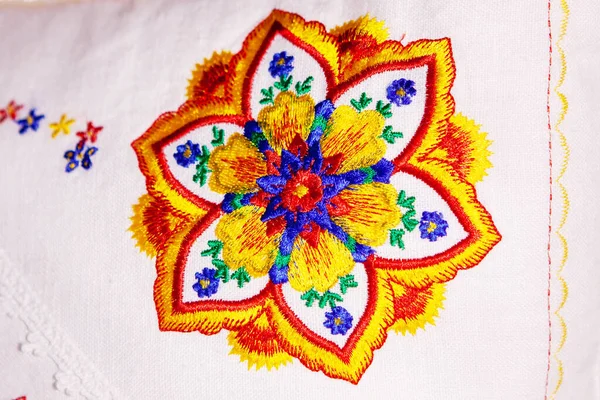 Colorful mandala embroidery design on white linen pillow. — Stock Photo, Image