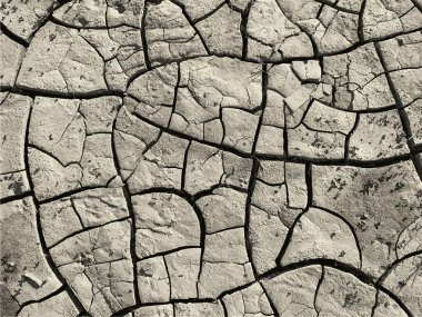 Çatlak yeryüzü arka planı. Toprak yüzeyinde çatlaklar var. Çamur çatlakları.