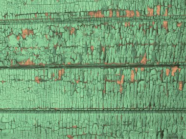 Yıpranmış boya desenli ahşap bir duvar.