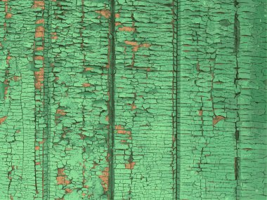 Yıpranmış boya desenli ahşap bir duvar.