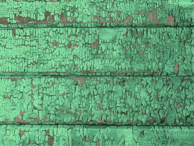 Yıpranmış boya desenli ahşap bir duvar.