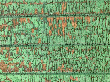 Yıpranmış boya desenli ahşap bir duvar.