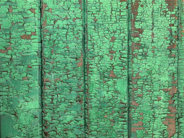 Yıpranmış boya desenli ahşap bir duvar.