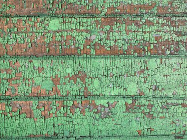 Yıpranmış boya desenli ahşap bir duvar.