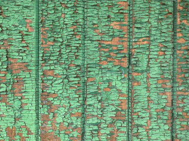 Yıpranmış boya desenli ahşap bir duvar.