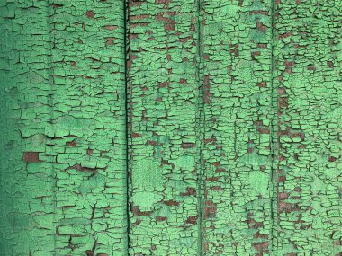 Yıpranmış boya desenli ahşap bir duvar.