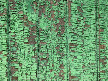 Yıpranmış boya desenli ahşap bir duvar.