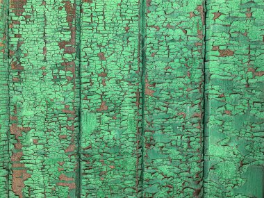 Yıpranmış boya desenli ahşap bir duvar.