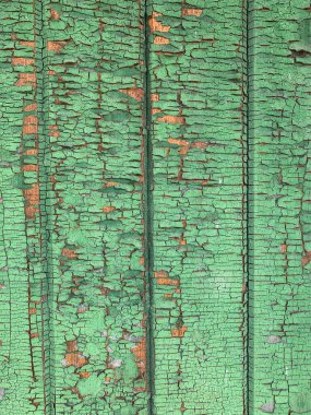 Yıpranmış boya desenli ahşap bir duvar.