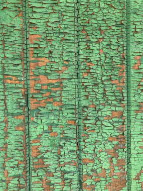 Yıpranmış boya desenli ahşap bir duvar.