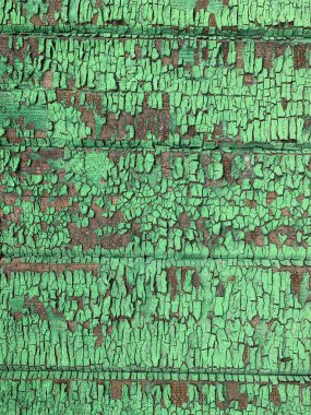 Yıpranmış boya desenli ahşap bir duvar.