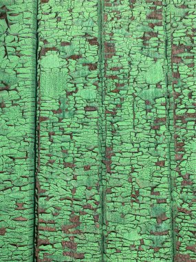 Yıpranmış boya desenli ahşap bir duvar.