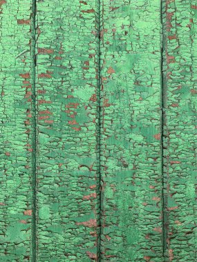 Yıpranmış boya desenli ahşap bir duvar.