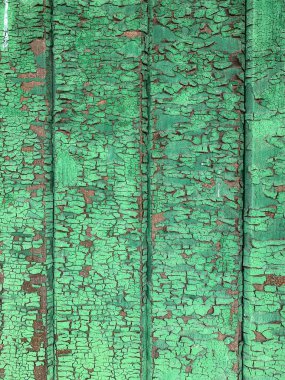 Yıpranmış boya desenli ahşap bir duvar.