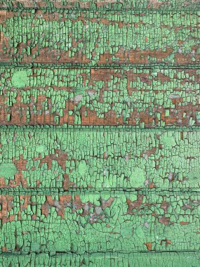 Yıpranmış boya desenli ahşap bir duvar.