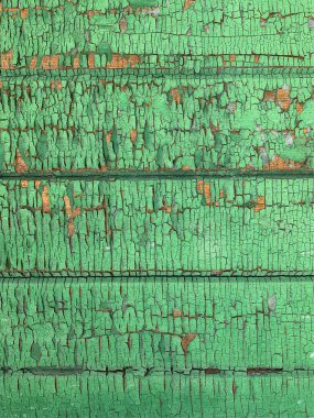 Yıpranmış boya desenli ahşap bir duvar.