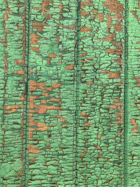 Yıpranmış boya desenli ahşap bir duvar.