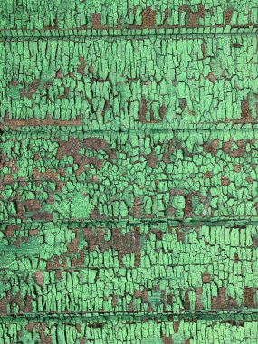 Yıpranmış boya desenli ahşap bir duvar.