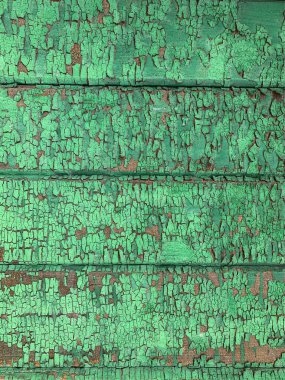 Yıpranmış boya desenli ahşap bir duvar.