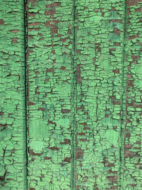 Yıpranmış boya desenli ahşap bir duvar.