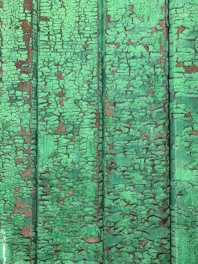 Yıpranmış boya desenli ahşap bir duvar.