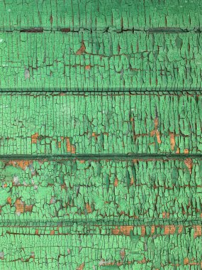 Yıpranmış boya desenli ahşap bir duvar.