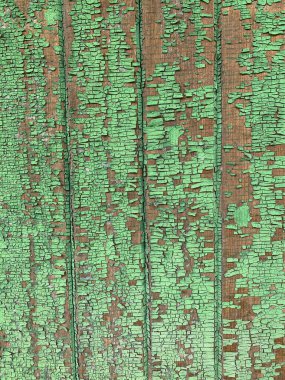 Yıpranmış boya desenli ahşap bir duvar.