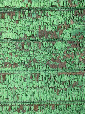 Yıpranmış boya desenli ahşap bir duvar.