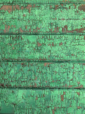 Yıpranmış boya desenli ahşap bir duvar.